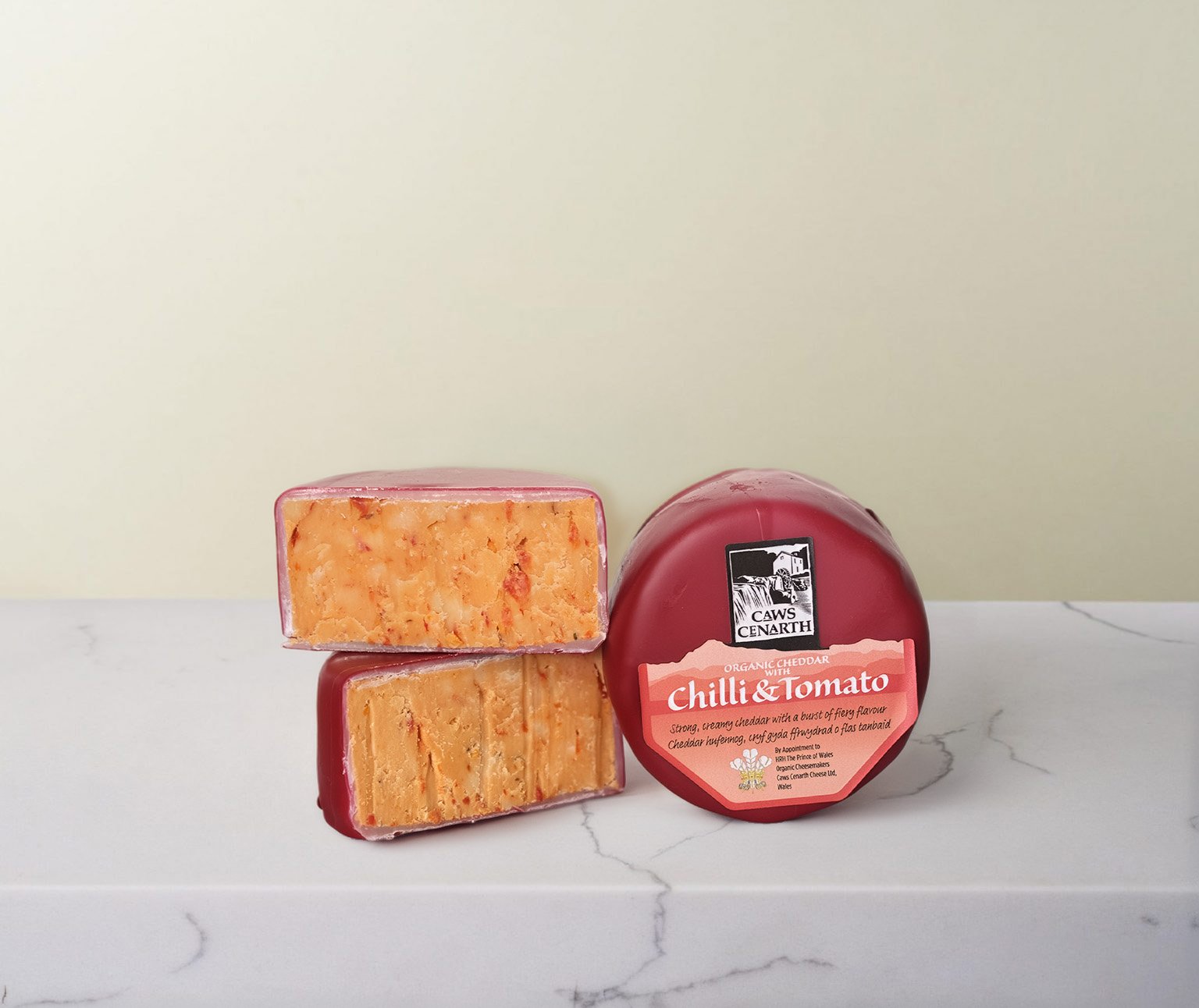 A 200g truckle of Caws Cenarth's Cheddar with Chilli & Tomato in red wax.